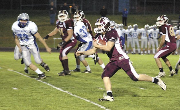 Lakewood junior quarterback Justin Peterson runs against South Whidbey.