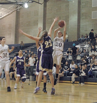 Arlington junior Quinn Kesselring takes a shot in the first half against Oak Harbor.