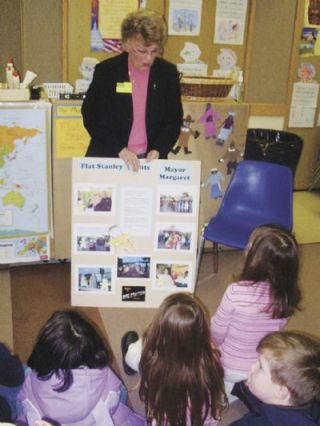 Arlington Mayor Margaret Larson shows Mary Shays first-through third-graders at Stillaguamish Valley School all the places that Flat Stanley accompanied her in October of 2007.