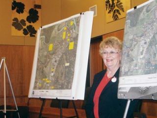 Mayor Margaret Larson shares her divine plan with the Downtown Arlington Merchants Association recently and was planning Monday a slightly different version for first- and second-graders at Stillaguamish Valley School this week.