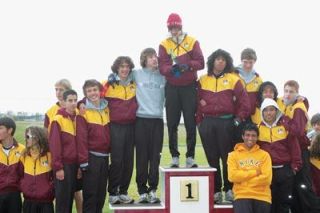 The Lakewood cross country team celebrates their Cascade Conference championship. Junior Nick Devier