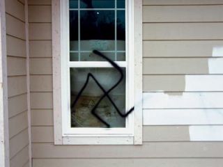 Arlington homeowner Tim Dehnhoff found a swastika and a racial slur spray-painted on the walls of his under-construction house Sept. 24