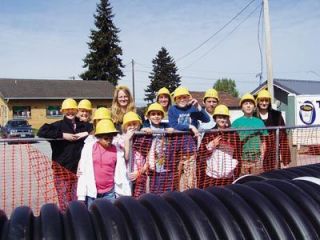 Pacific Learning Center students get a front row view of the Olympic Avenue street project. They are