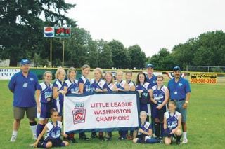 The girls of Stilly Valley Elite hold up their championship banner at David Douglas Field in Vancouver