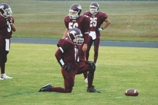 Steven Marquardt rests between defensive snaps for the Cougars.  Many of the Cougar lineman were forced to play both sides of the ball and deal with the double fatigue.