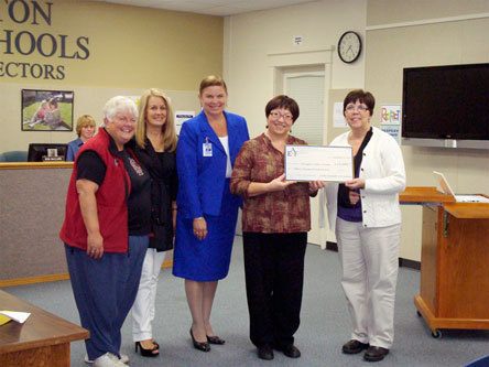 School Board President Kay Duskin; Arlington Educational Foundation member Anita McKinley; Superintendent Kristine McDuffy; Pioneer Elementary music instructor Susan Schultz and Kent Prairie Elementary music instructor Laurie Breon