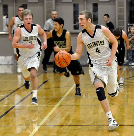 Arlington junior guard Terry Dawn leads the charge against Marysville Getchell in the Eagles’ season opener on Nov. 29.