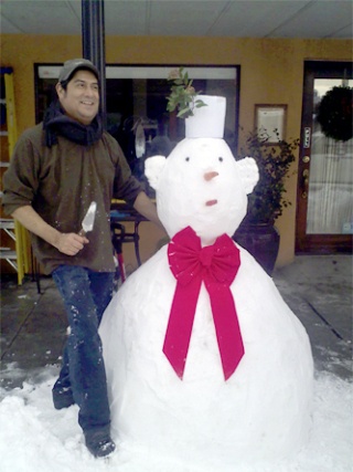 Martin Estrada-Perez cleared the snow off the canopy at The Bistro and put it to good use.