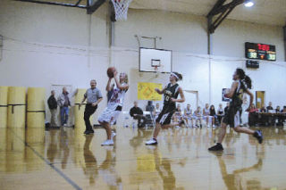 Highland Christian senior Kaila Graber scores on a fast break