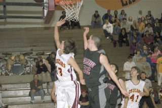 Senior Jordan Stauffer converts a lay-up in traffic.