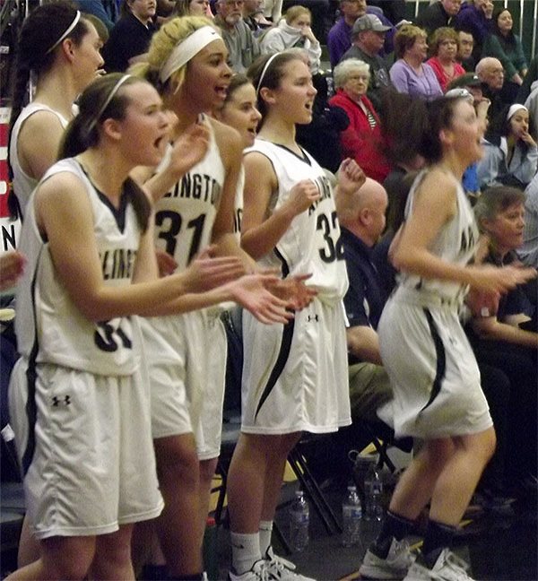 Arlington girls cheer with joy as their team beat Edmonds Woodway in overtime Feb. 21.