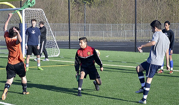 The Arlington soccer team practices for its first game.