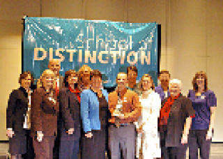 Post Middle School Principal Brian Beckley is joined by teaching staff Denise Jackson