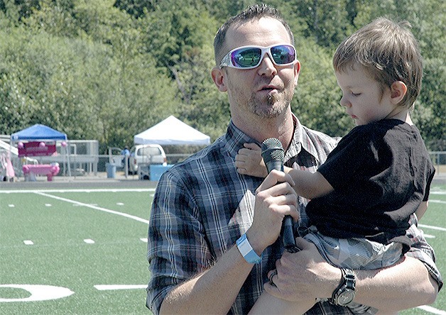 Mitch Latta holds his son Bentley