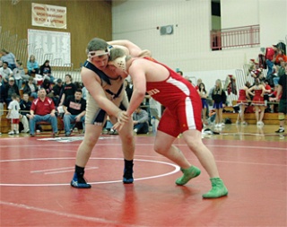 Arlington senior Bryant Dickerson and M-P senior Ricky Dschaak meet in the heavyweight semifinals. Dickerson won 12-5