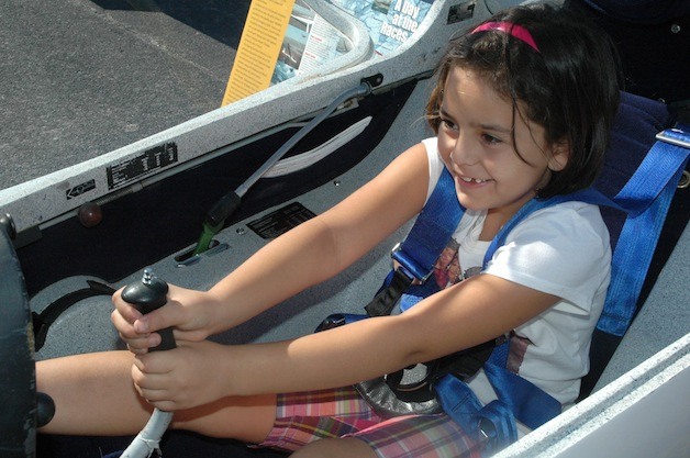 Sarah Bates grabs the controls of a German Grob Twin Astir glider during the Sept. 20 Arlington Airport Appreciation Day.