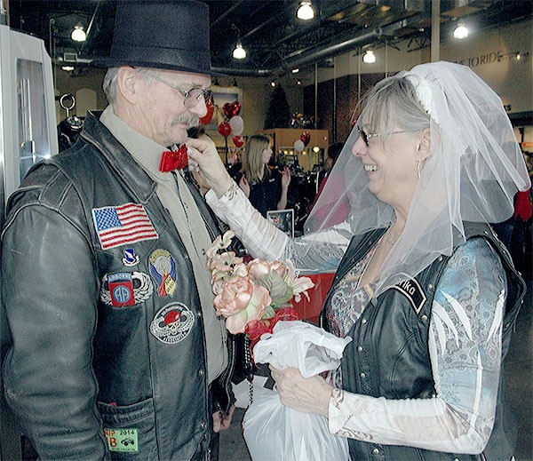 Arlington's Gordon and Mary Quehrn prepare to renew their wedding vows at Sound Harley-Davidson in Smokey Point Feb. 14.