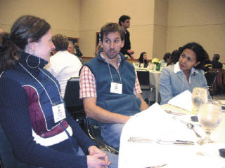 Arlington farmers Mark and Patricia Lovejoy visit with fellow farmer Katrina Djberof at the  Focus on Farming conference at the Lynnwood Conference Center Nov. 22.