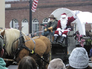 Santa Claus travels in style with Mark Winterhalter driving Sugar and Spice in downtown Arlington in 2007.