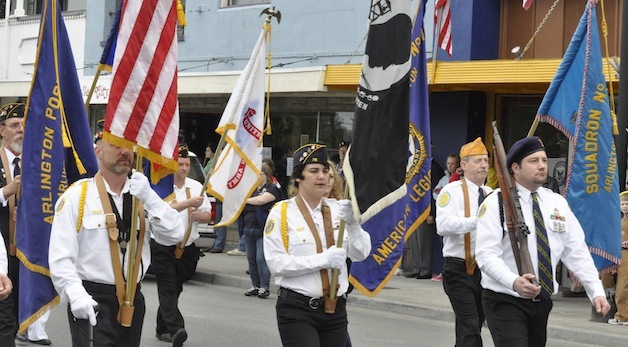 Members of Arlington American Legion Post 76 marched down Olympic Avenue as part of Arlington's annual Memorial Day parade last year.