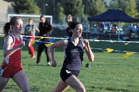 Arlington sophomore Teresa Wadey makes her move down the home stretch of the 200-meter race.