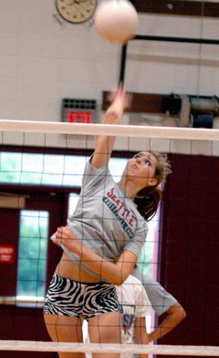 Senior Hayley Liebel spikes a ball during practice Aug. 26.