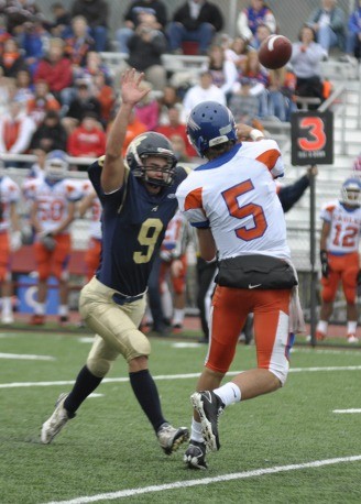 Skylor Elgarico forces Bethel quarterback Justin Hordyk to hurry a throw in the second half.