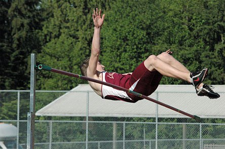 Lakewood freshman Justin Peterson clears the high jump bar set at 6-2 to tie a personal best and win the Cascade Conference title at Cedarcrest High School.