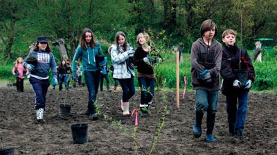 Students from Elger Bay Elementary School on Camano Island recently planted about 250 trees over two days at the Country Charm Conservation area in Arlington.