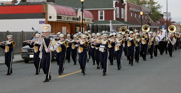 The Arlington High School Marching Band blasts down Olympic Avenue as part of the Oct. 16 Homecoming Parade.