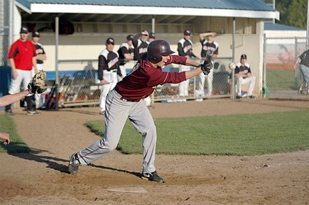 Senior catcher Micheal Leach lays down a sacrifice bunt in the seventh inning.