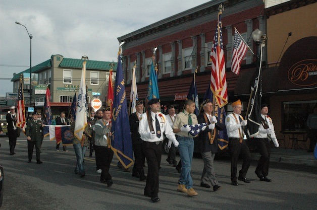 Arlington American Legion Post 76 proceeds south on Olympic Avenue during the annual Arlington Veterans Day parade on Nov. 11.