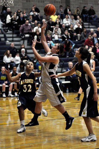 Arlington junior guard Lauren Grogan attempts a runner during one of many Eagles fastbreaks against Mariner.