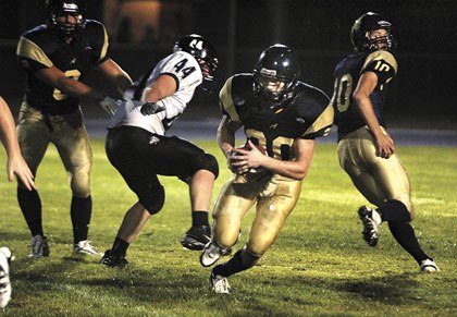 Riley Cobb gets past the line of scrimmage on a run in the third quarter.