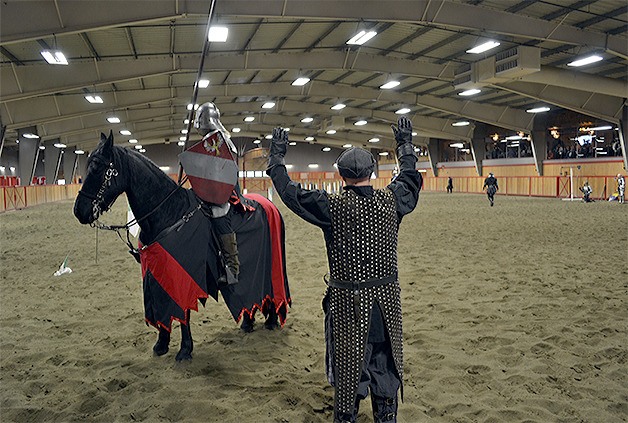 Knight Chuck Davenport is held up in his joust by marshal Lee Kessler during the Seattle Knights performance at the Rhodes River Ranch in Oso Oct. 24. The troupe performs there every few months and love the facility because it's covered.