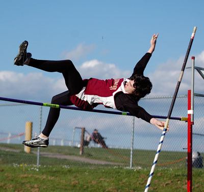 Freshman Taigan Dalton clears the eight-foot mark in the pole vault competition.