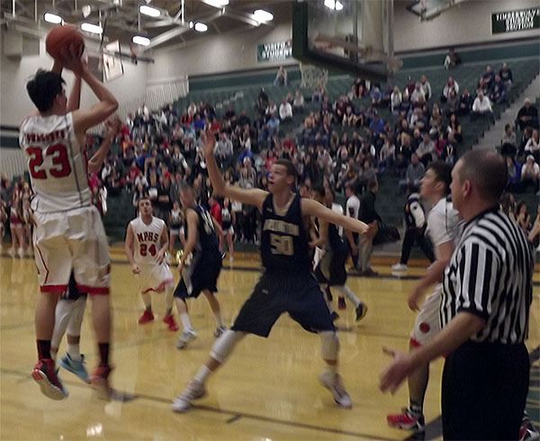 M-P's Michael Painter (23) sinks a short jump shot against Arlington. The Eagles held the Tomahawk standout to just eight points.