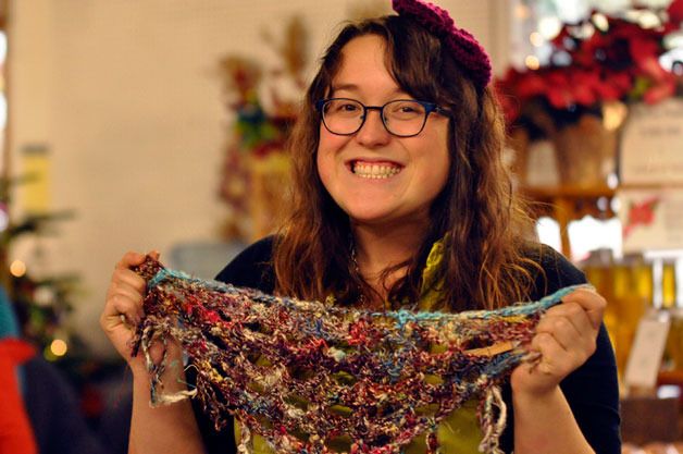 Christina Corvin displays her own hand-crocheted items at the Arlington Farmers Market’s Handmade Holiday event on Saturday