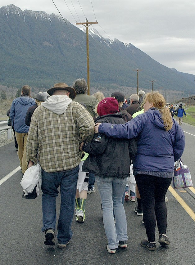 Participants walk up Highway 530 for the Oso remembrance Sunday