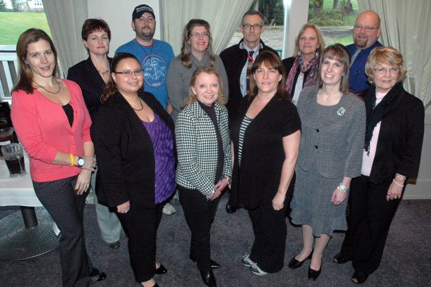 The Arlington-Smokey Point Chamber of Commerce Board for 2013. Back row from left