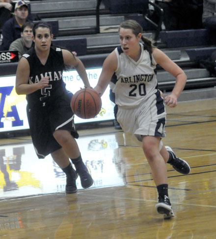 Arlington junior guard Krista Showalter reads the defense as she drives into the key against Kamiak on Dec. 3.