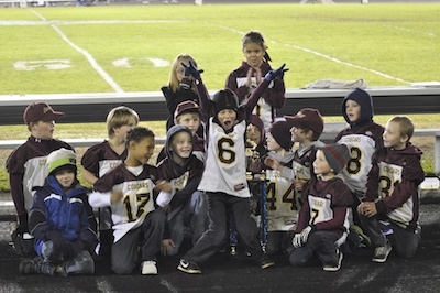 Lakewood Pee Wee Cougars middle linebacker Ryan Orr strikes a pose as he and a handful of his teammates are honored at halftime of Lakewood High School football's 2A playoff game against Burlington-Edison High School on Nov. 4.