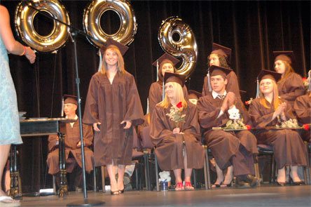 Members of the Weston High School class of 2009 beams with pride and happiness as they prepare to receive their high school diplomas at the Byrnes Performing Arts Center Wednesday