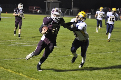 Lakewood junior quarterback Justin Peterson stiff-arms Burlington-Edison safety Jae Evans on the way to the end zone in Lakewood's 55-0 2A District playoff win on Nov. 4.