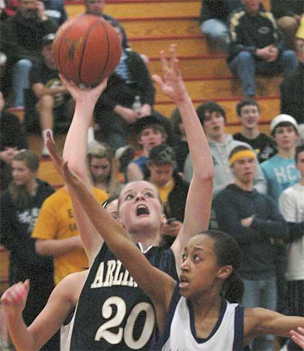 Eagles junior Quinn Kesselring grabs a rebound and goes back up with it for two points in a win over Kamiak to keep the team’s season alive.