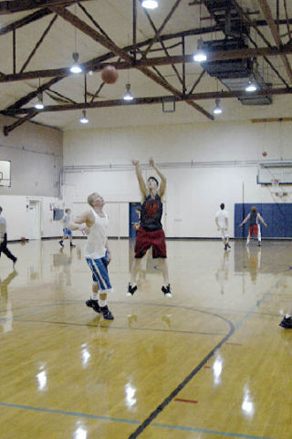 Senior Caleb Brown defends teammate Jeff Kelly in a early season practice. Both return from junior seasons in which they received all-conference recognition.