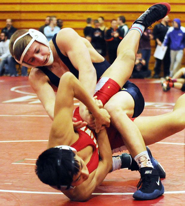 Arlington's Jeremy Nygard works to pin his opponent during the M-P premier Jan. 17.