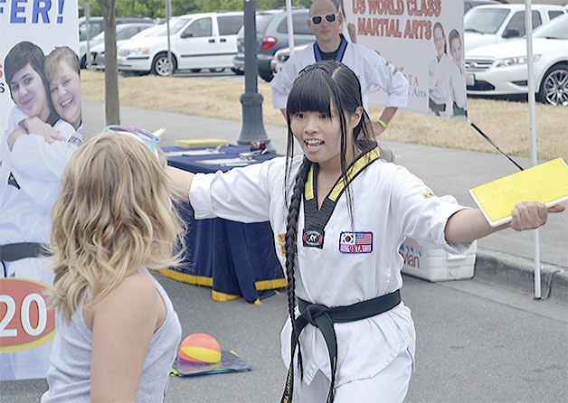 Mimi Tansayni of Arlington was part of a martial arts demonstration at the Street Fair.