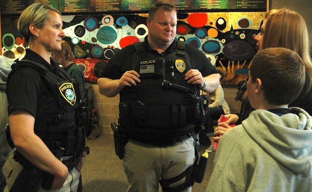 Arlington Police officers Molly Ingram and Rory Bolter meet with members of the public at ‘Out of the Shadows’ April 28.