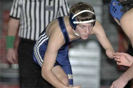 Hunter Amundson prepares to shoot on Monroe opponent Jake Elledge. Amundson was a last-second call to come in and recorded a pin in 2:40.